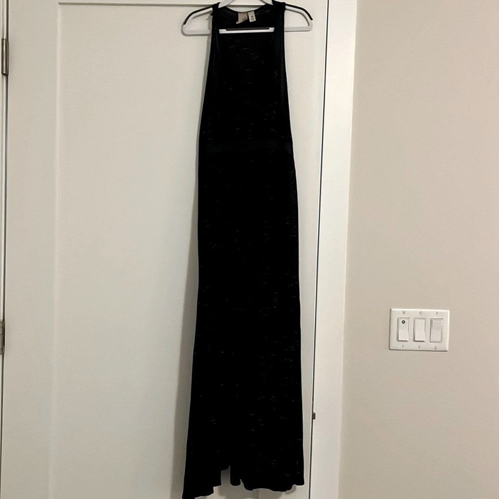 Jersey knit racer back maxi dress with front slit. Cinched elastic waist.